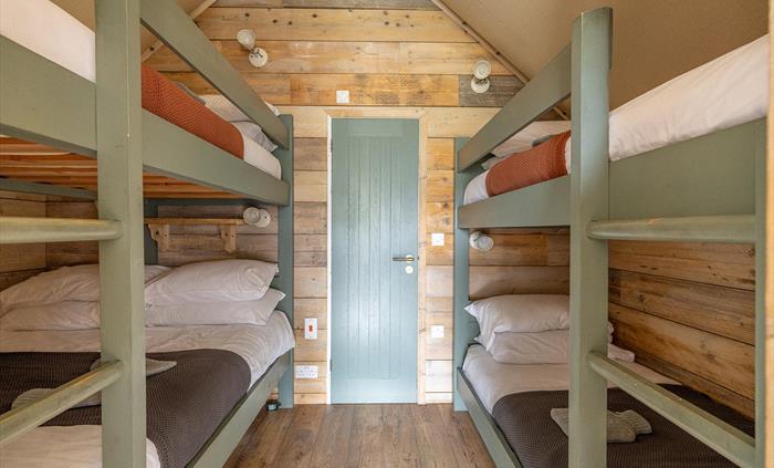 Each tent either has a king bed plus 2 or 3 single beds.